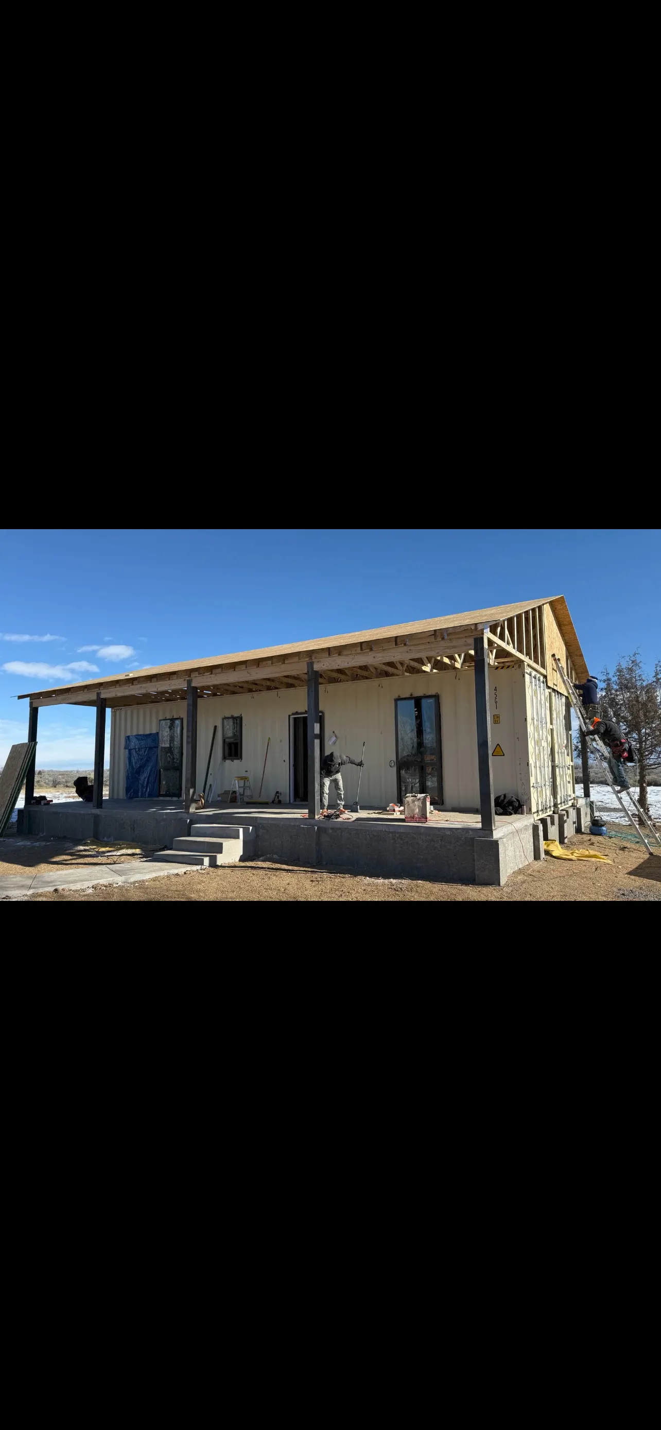 640 SF 2-bedroom container home with metal roof and covered porches, Alamosa Colorado